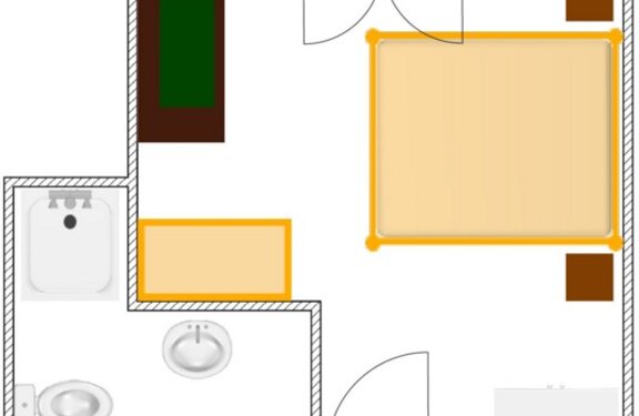 Grundriss eines Zimmers mit Bett, Tisch, Waschbecken, Toilette und zwei Türen